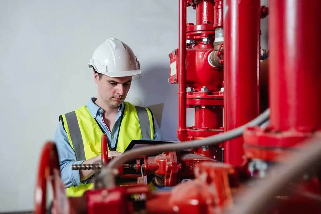 Close-up of pipes and valves, representative of fire pump and hydraulic system components